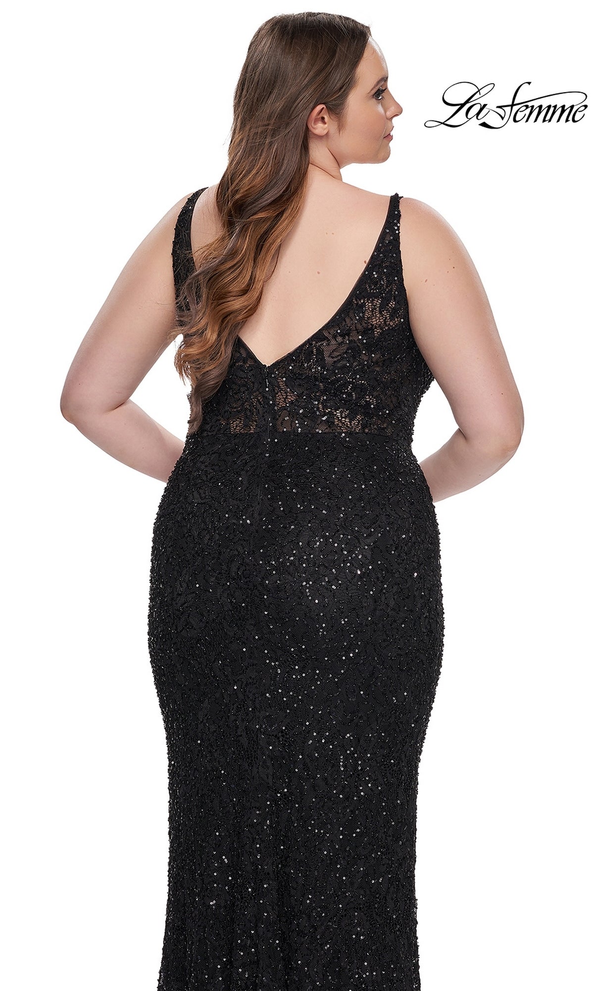 Woman wearing a sleeveless, black Plus-Size Lace Prom Dress: La Femme 31535 with sequins and a V-back, standing against a white background—an elegant long formal gown ideal for any special event.